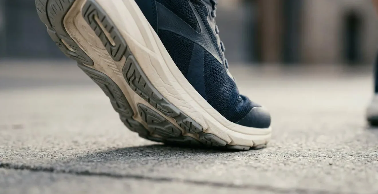 Close-up view of foot biomechanics during walking showing natural arch compression and weight distribution
