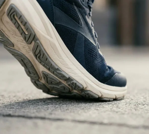 Close-up view of foot biomechanics during walking showing natural arch compression and weight distribution