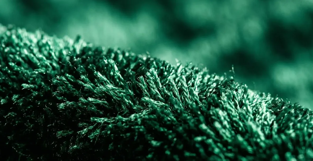 Extreme close-up of velvet fabric pile showing individual fibers and textile structure