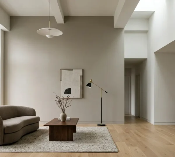 Modern living room interior showcasing matte painted walls with clean architectural lines and natural lighting